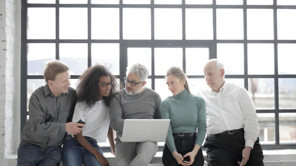 service business owner reviewing lead follow-up workflow on laptop and phone