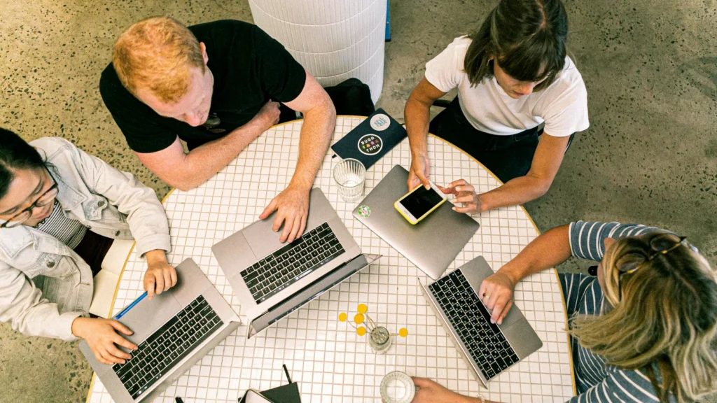 sales team reviewing AI chatbot CRM integration workflow on laptop